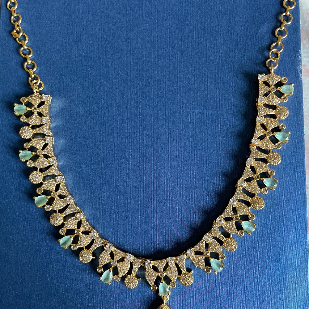 Elegant Gold-Tone Necklace with Light Blue Teardrop Stones